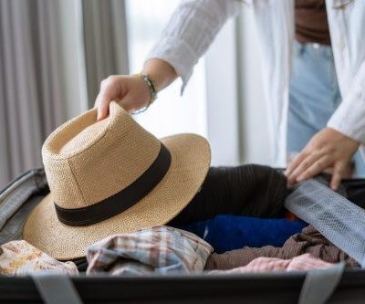 woman packing suitcase